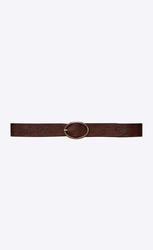 Belt with oval buckle in perforated raw leather